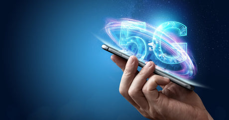 A person holding a phone beneath a bright 5G graphic with a swirling digital ring on a vivid blue background.
